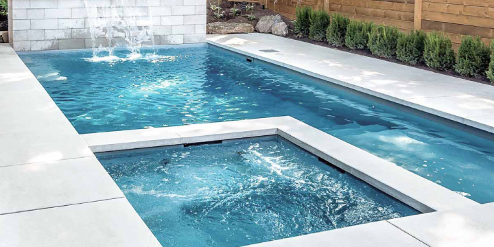 Custom white pergola installed over a patio area in Edwardsville, IL.